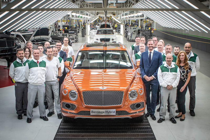 Production colleagues alongside the first Bentayga Hybrid
